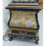 A mid 20thC black and gilt painted metal chest and cover,