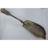 A Victorian silver fiddle pattern fish slice with a line engraved and pierced,
