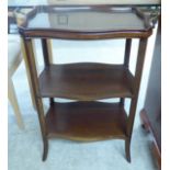 An Edwardian string inlaid mahogany tray top three tier etagere,