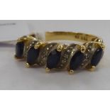 An 18ct gold sapphire and diamond set ring 11