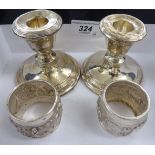 A pair of loaded silver dwarf candlesticks marks rubbed 3''h;