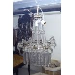A mid 20thC gilt metal bag design centre light fitting with multiple cut glass drops 21''h