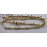 An 18ct gold twist bar and ring link necklace,