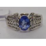 A white metal tanzanite and diamond set ring 11