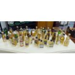 A large collection of whiskey miniatures: to include 'Glen Grant' RSF