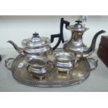 A silver plated presentation tea set comprising a teapot, coffee pot, milk jug,