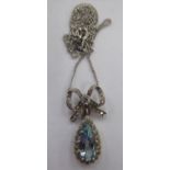 An 18ct white gold aquamarine and diamond set, ribbon design pendant,