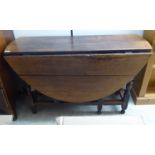 A late 18thC country made oak gateleg table, the oval,