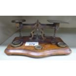 A set of early 20thC brass postal scales,