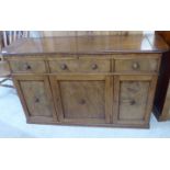 A late 19thC mahogany drinks cabinet sideboard with three facsimile frieze drawers,