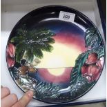 A Moorcroft pottery plate 'The Millennium Birth of Light',