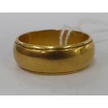 An 18ct gold 'wide' band ring 11