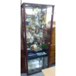 A modern partially glazed display cabinet with a mirror, panelled back and four shelves,
