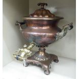 A late Victorian copper and brass samovar with an internal heating block, twin bar handles,