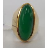 A 14ct gold signet style jade coloured ring 11