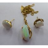 A pair of opal set gold coloured metal earrings; and a claw set opal pendant,