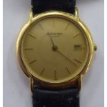 A Raymond Weil 18ct gold plated cased quartz wristwatch, faced by a baton dial with date aperture,