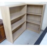 A pair of Ikea light oak effect two tier, open front bookcases, on plinths 42''h 31.