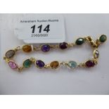 A 14ct gold multi-coloured stone set bracelet,