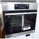 An AEG (unused) integrated oven with a brushed, stainless steel front 23''h 23.