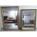 Two similar modern mirrors, one bevelled,