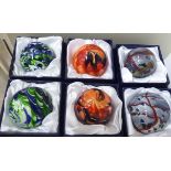 Six glass paperweights various colours and designs boxed OS10