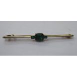 A bi-coloured gold metal bar brooch,