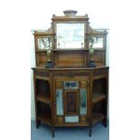 An Edwardian carved satin mahogany sideboard with a bevelled mirror panelled upstand,