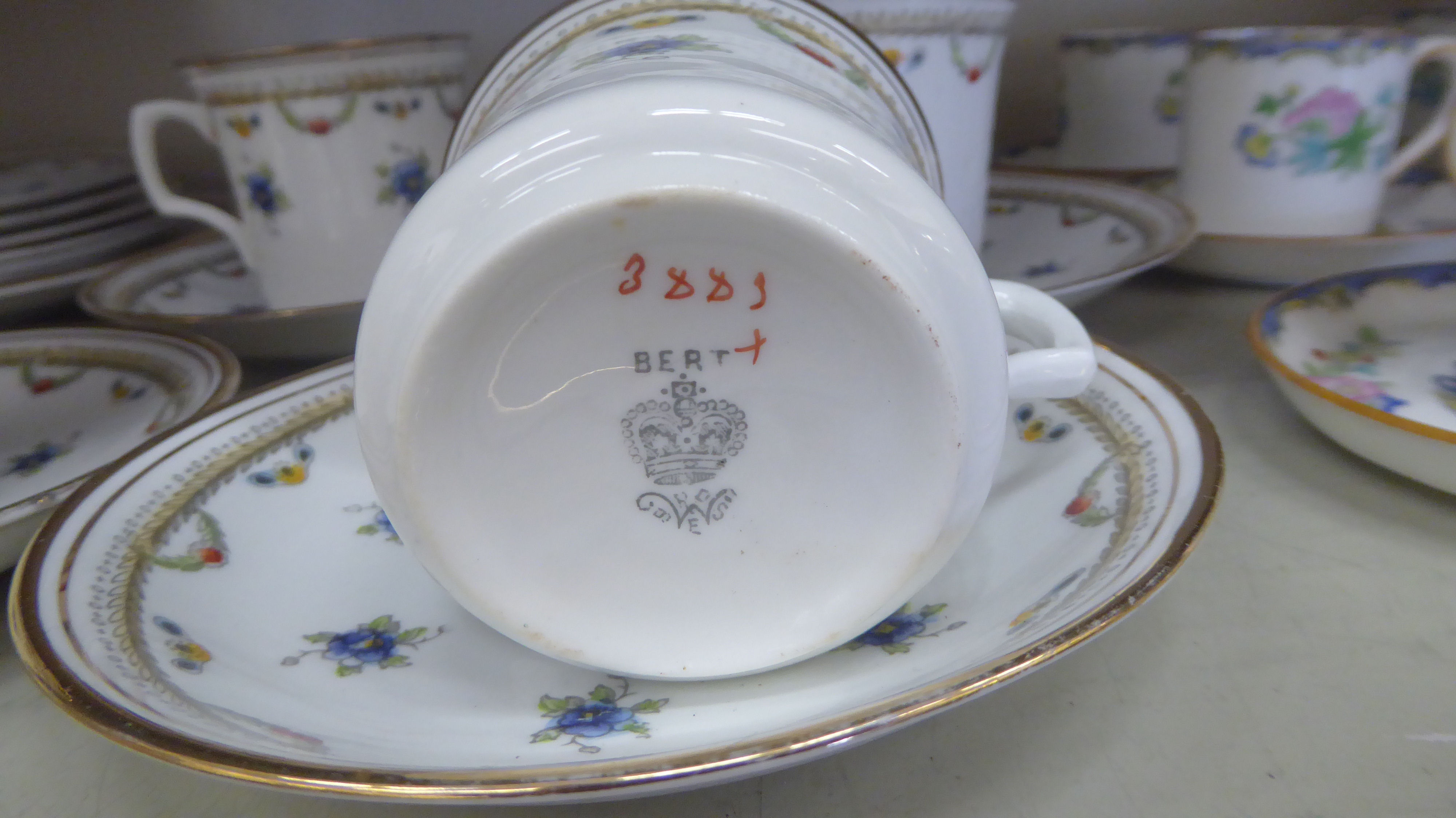 Mintons china coffee cans and saucers, decorated with flora, - Image 4 of 4