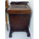 A mid/late 19thC rosewood Davenport with a hinged lid,
