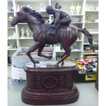 A modern cast and patinated bronze, a horse and jockey, on an integral plinth 27.