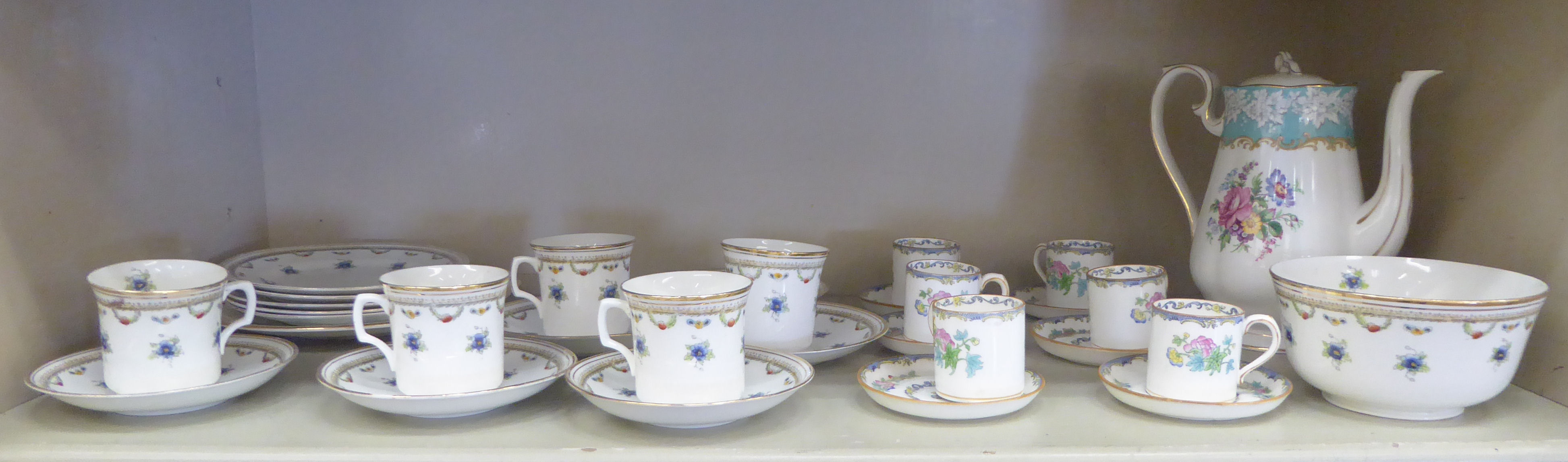 Mintons china coffee cans and saucers, decorated with flora,