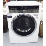A Grundig (unused) washer/dryer, in white casing 32.5''h 23.