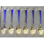 A set of six Danish silver gilt teaspoons with blue enamelled stems and crown finials cased