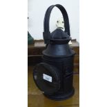 A reproduction of a black painted metal railway signal lamp 12''h BSR