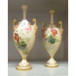 A pair of early 20thC Royal Worcester blush ivory china, twin handled vases,