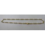 A 14ct gold twist bar and ring link necklace,