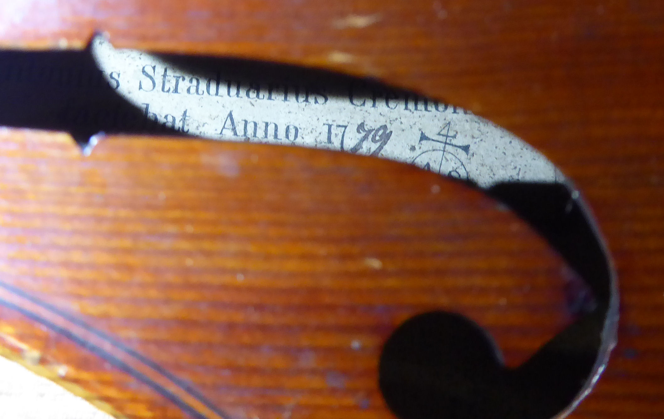 An early 20thC copy of an Antonius Stradivarius violin with a 14''L two piece back and a bow, - Image 5 of 8