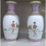A pair of early 20thC Chinese porcelain baluster shaped vases with narrow necks and flared cup rims,