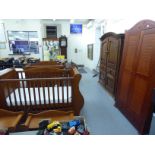 A child's Mothercare mahogany nursery suite comprising a wardrobe with two doors and a drawer