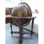 A modern cocktail cabinet, fashioned as a globe, bordered by astrological images,