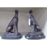 A pair of 20thC Victorian design patinated bronze models, seated greyhounds,