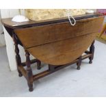 A late 18thC country made oak gateleg table,