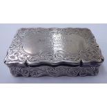 An early Victorian silver snuff box of serpentine outline with bright-cut engraved ornament