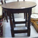 A 19thC style oak occasional table,