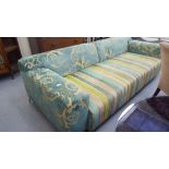 A modern patterned fabric upholstered three person settee,