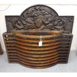 A 19thC shaped cast iron fireback 22''h 29''w;