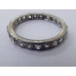 A white gold coloured metal diamond set full eternity ring 11