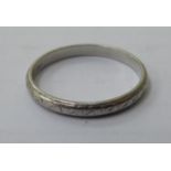 An engraved platinum wedding ring 11