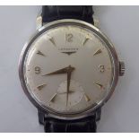 A Longines stainless steel cased wristwatch, faced by an Arabic and baton dial,